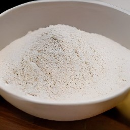 the output is a dry mixture of whole-grain wheat flour, all-purpose flour, brown sugar, baking soda, ground ginger and ground cinnamon.