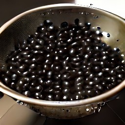 black beans that have been rinsed and drained in a colander.