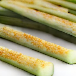 the zucchini is now coated in the breadcrumbs mixture.