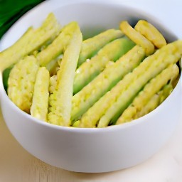 zucchini sticks that are coated in an egg mixture.