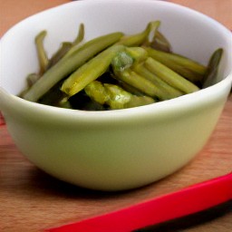 a bowl of green beans that have been cooked in the microwave for 4 minutes.