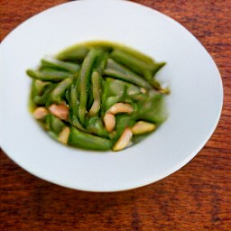 the green beans mixture is transferred to a plate.