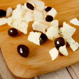 a chopped black olives, feta cheese, and cherry tomatoes.