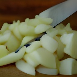 a peeled and diced yellow onion, chopped tomato, and chopped cilantro.