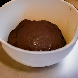 the dry mixture is transferred to the cocoa mixture and whisked to get a dough.