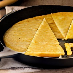 the farinata is cut into slices.