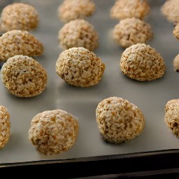 oatmeal balls on a baking sheet.