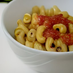 a bowl of macaroni pasta mixed with cheese and canned stewed tomatoes.