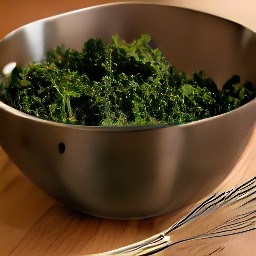 a bowl of kale that is fully marinated in a mixture of cider vinegar, olive oil, and 1.5 tsp of salt.