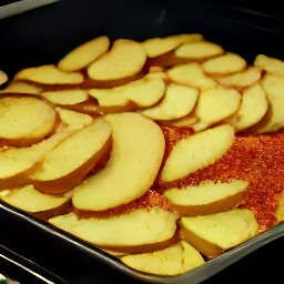 the potato slices are coated in butter and have allspice seasoning on them.