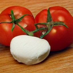 the output is halved and deseeded tomatoes, then chopped, with mozzarella cheese cut into cubes.