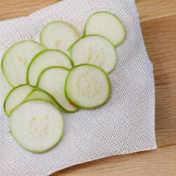 the paper towel has been removed from the zucchini slices.