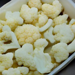 the cauliflower coated in a mixture of garlic-olive oil, salt, and black pepper.