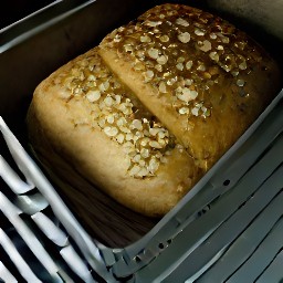 a loaf of bread with rolled oats on top.