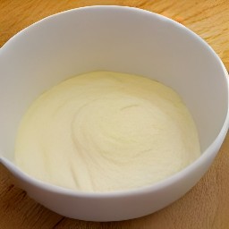 the egg mixture is transferred to the flour mixture and stirred with a wooden spoon for 2 minutes to get a batter.