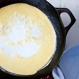 flipping semi-cooked pancakes with a fish slice.