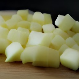 pineapples, onions, carrots, and ginger that are peeled, cubed, and chopped.