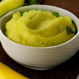 the cooked summer squash is mashed for 2 minutes with a fork, and then put into a second bowl.
