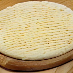 the pizza crust coated in a thin layer of olive oil.