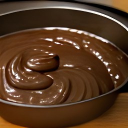 the batter is transferred to a cake pan.