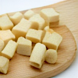 the loaf of bread is cut into cubes.