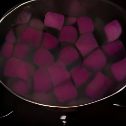 adding cubed beets to the boiling water.