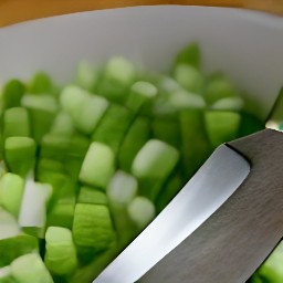 the output is a chopped cucumber, chives, spring onion, and spearmint.