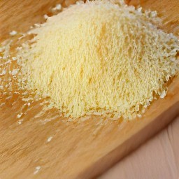 the parmesan cheese is shredded into thin pieces.