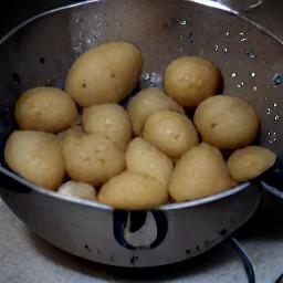after boiling the water for four minutes, add the potatoes and cook for 20 minutes. once finished, turn off the heat and drain the potatoes in a colander.