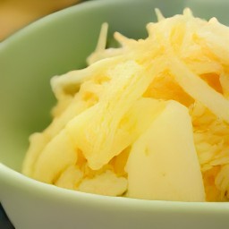 a bowl of cabbage and potato fry.