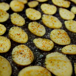 a flat surface of roasted potatoes.