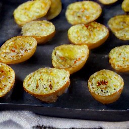 the baking sheet is taken out of the oven and the heat is turned off.