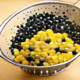 black beans and corn that have been rinsed in a colander.