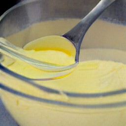 a bowl of egg, margarine, vanilla extract, baking powder, baking soda, granulated sugar and all purpose flour mixture.