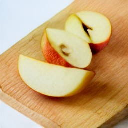 the apple is cut into wedges.