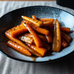

A delightful gluten-free, eggs-free and nuts-free side dish of stirfried carrots, parsnips and onions glazed with sweet honey for a truly scrumptious experience.