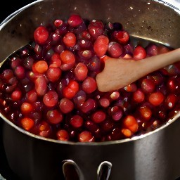 the cranberries, sugar, and orange juice are cooked together for 5 minutes.