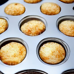 the topping mixture is sprinkled over the muffin tin.