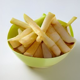 the turnip sticks in the bowl now have black pepper sprinkled on them.