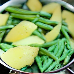 the veggie mix is drained in a colander.