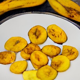 a flattened plantain on a plate.