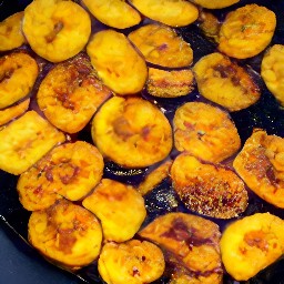 the plantain slices are golden brown.