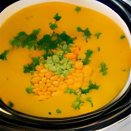 a crock pot full of red lentil soup.