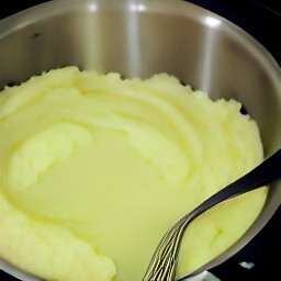 the potatoes are mashed and there is now a pile of mashed potatoes.