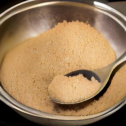 a bowl containing brown sugar, wheat bran, and raisins.