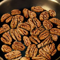the pecans are evenly coated and then removed from the heat.