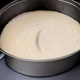 a cake is baking in the oven.