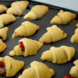 a baked cherry stuffed croissant.