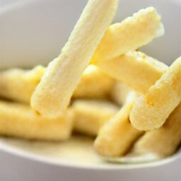 the cheese strips are coated in the egg mixture.