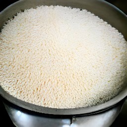 long-grain white rice that has been rinsed in a colander.